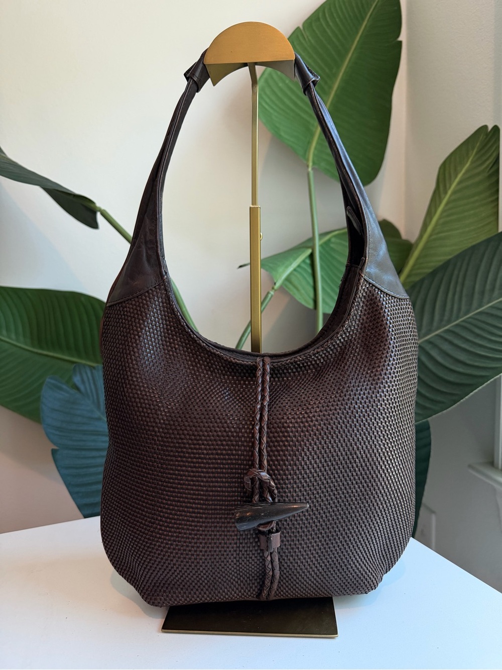 The Sak ‘Leather Woven Bag with Horn Closure.